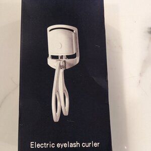 Heated eyelash curler brand new
